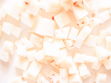 Vintage looking Diced cheese with red hot chilli peppersの写真素材