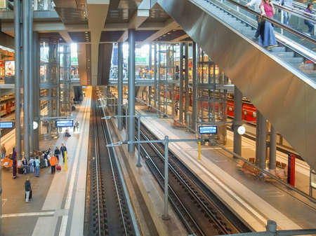 BERLIN, GERMANY - CIRCA APRIL, 2010: Travellers in the new Berlin Hauptbahnhof central stationのeditorial素材