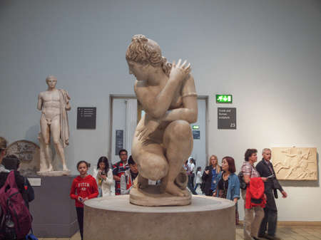 LONDON, UK - CIRCA JUNE, 2013: Tourists visiting an ancient statue of Venus Aphrodite goddess of love at the British Museumのeditorial素材