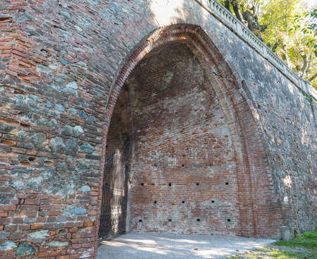 Ancient gothic arch made of red bricksの写真素材
