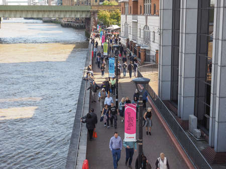 LONDON, UK - SEPTEMBER 29, 2015: Tourists walking on the River Thames South Bankのeditorial素材