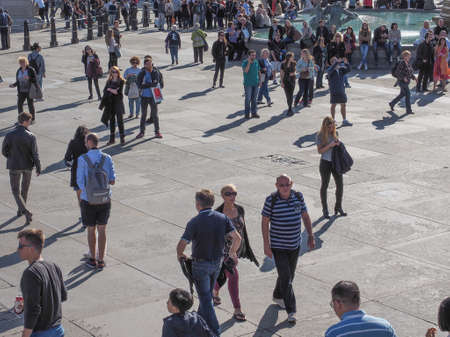 LONDON, UK - SEPTEMBER 27, 2015: Tourists in Trafalgar Squareのeditorial素材