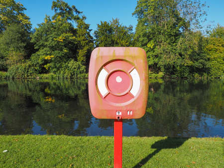 A lifebuoy on a river bankの写真素材