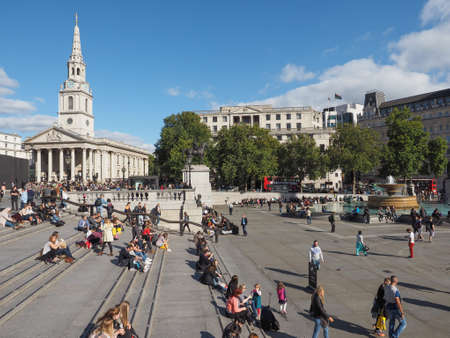 LONDON, UK - SEPTEMBER 27, 2015: Tourists in Trafalgar Square in front of St Martin in the Fields churchのeditorial素材