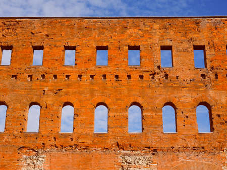 Vintage looking Palatine towers Porte Palatine ruins of ancient roman town gates in Turinの写真素材