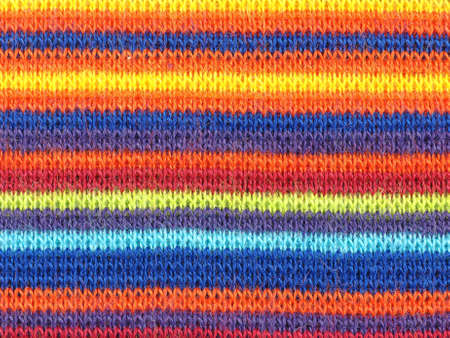 Multicoloured striped fabric texture useful as a backgroundの写真素材