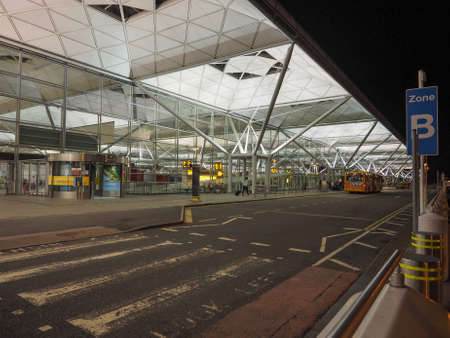 STANSTED, UK - SEPTEMBER 29, 2015: London Stansted airport design by architect Lord Norman Foster at nightのeditorial素材