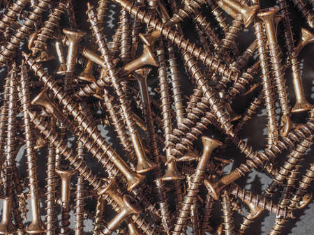 Many bronze screws for woodの写真素材