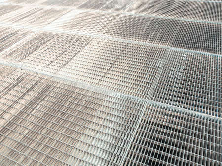Steel grid mesh useful as a background - cool cold toneの写真素材