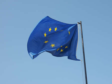 The national flag of European Union floating over blue skyの写真素材