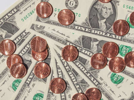 One cent coins and One Dollar banknotes  currency of the United States useful as a backgroundの写真素材