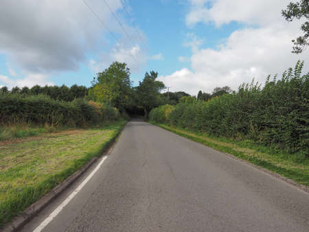 Road in the English countryside in Tanworth in Arden Warwickshire, UKの写真素材