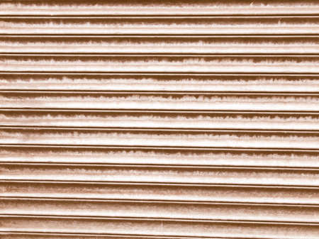 Vintage looking Corrugated steel shutter useful as a backgroundの写真素材