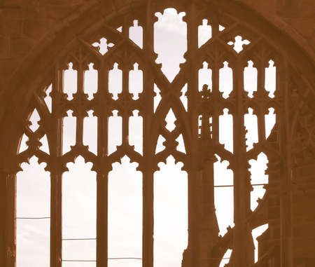 Ancient gothic window dark silhouette against the sky vintage