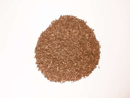 Heap of loose tea leaves on a table vintageの写真素材