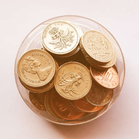 British Pounds coins (UK currency) in a box vintage