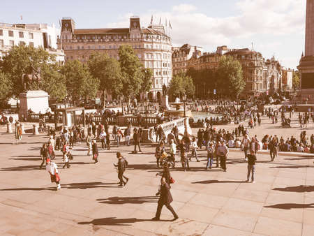 LONDON, UK - SEPTEMBER 27, 2015: Tourists in Trafalgar Square vintageのeditorial素材