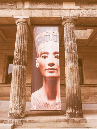 BERLIN, GERMANY - MAY 10, 2014: Banner with Egyptian queen and Sun Goddess Nefertiti in front of the Neues Museum which hosts her bust vintageのeditorial素材