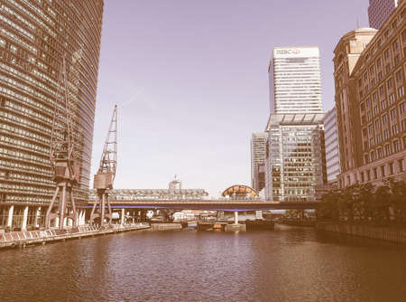 LONDON, UK - JUNE 11, 2015: The Canary Wharf business centre is the largest business district in the United Kingdom vintageのeditorial素材