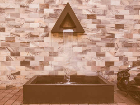 MILAN, ITALY - APRIL 10, 2014: The Sandro Pertini monument in Milan dedicated to the former Italian President was designed by architect Aldo Rossi in 1988 vintageのeditorial素材