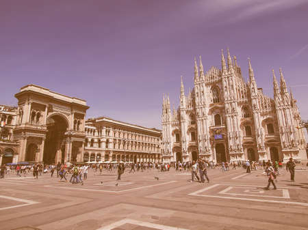 MILAN, ITALY - MAY 16: Tourists visiting the famous Piazza Duomo square in Milan Italy on May 16, 2011 in Milan, Italy vintageのeditorial素材