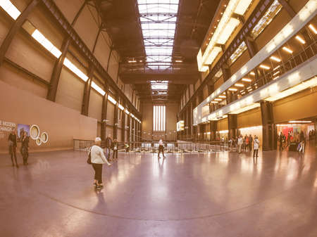 LONDON, UK - SEPTEMBER 28, 2015: The Turbine Hall once housed the electricity generators of the power station now a public space part of Tate Modern art gallery in South Bank seen with fisheye lens vintageのeditorial素材