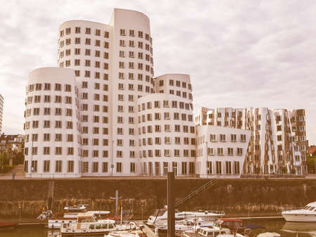 DUESSELDORF, GERMANY - AUGUST 3, 2009: The new Medienafen is a redevelopment area in the former docklands and harbour with buildings designed by Steven Holl, David Chipperfield and Frank O Gehry vintageのeditorial素材