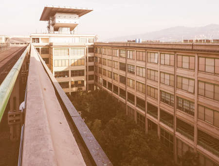 TURIN, ITALY - DECEMBER 16, 2015: Fiat Lingotto car factory designed by Trucco in 1916 now an exhibition centre was the largest car factory at the time of construction vintageのeditorial素材