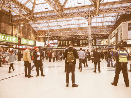 LONDON, UK - SEPTEMBER 29, 2015: Travellers at Charing Cross railway station vintage