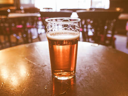 A pint of English ale beer in a pub vintageの写真素材