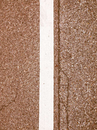 Street lane sign painted in white on black asphalt vintageの写真素材