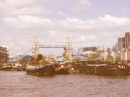 River Thames in London in front with Tower Bridge vintageの写真素材