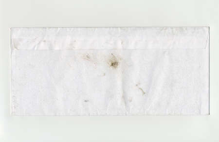 Grunge dirty paper letter envelope with stainsの写真素材