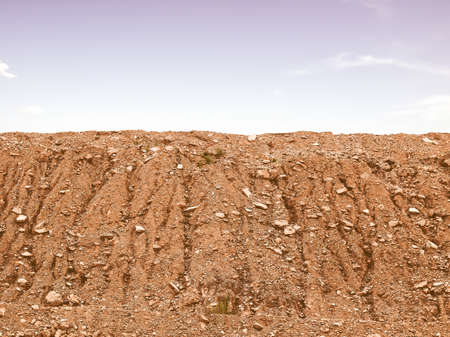 Vintage looking Mountain top with blue sky with cloudsの写真素材