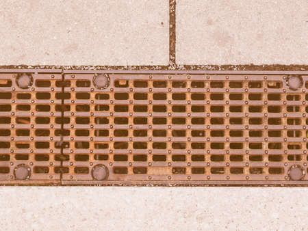 Detail of a manhole in the street vintage
