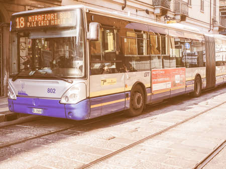 TURIN, ITALY - FEBRUARY 19, 2015: Pedestrians and buses in Turin city centre vintageのeditorial素材