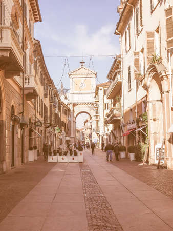 CHIERI, ITALY - JANUARY 14, 2015: Tourists visiting Via Vittorio Emanuele high street in the city centre vintageのeditorial素材