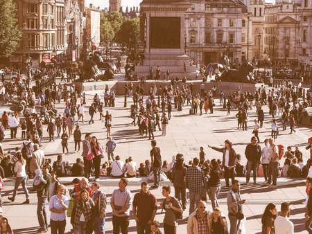 LONDON, UK - SEPTEMBER 27, 2015: Tourists in Trafalgar Square vintageのeditorial素材