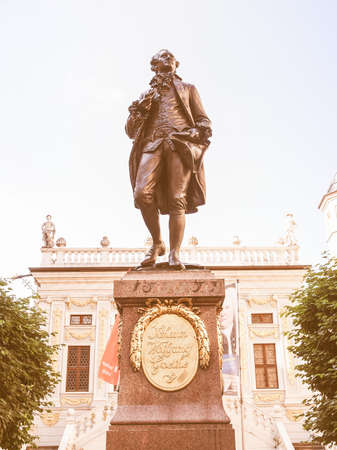 LEIPZIG, GERMANY - JUNE 12, 2014: The Goethe Denkmal monument to Dichter J W von Goethe stands in the Naschmarkt square in front of the Old Stock Exchange since 1908 vintageのeditorial素材