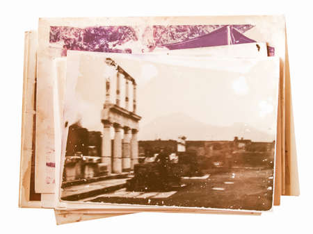 Pile of old photographs isolated over white vintageの写真素材
