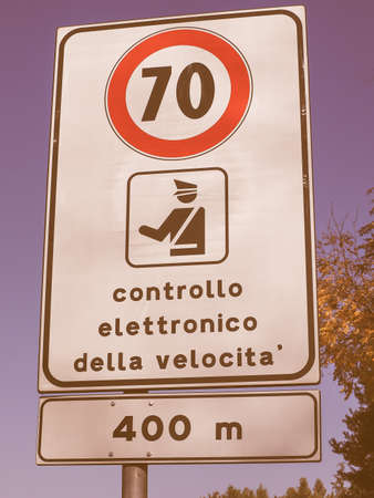 Regulatory signs, Maximum speed limit traffic sign with Italian text controllo elettronico della velocita meaning electronic speed check vintageの写真素材