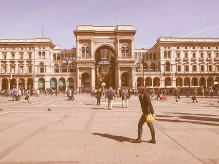 MILAN, ITALY - APRIL 10, 2014: Tourists visiting the Piazza Duomo square in Milan Italy vintageのeditorial素材
