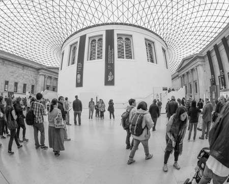 LONDON, UK - SEPTEMBER 28, 2015: Tourists in the Great Court at the British Museum designed by architect Lord Norman Foster opened in year 2000 seen with fisheye lens in black and whiteのeditorial素材