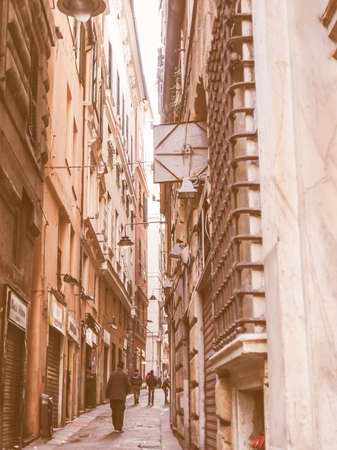 GENOA, ITALY - MARCH 16, 2014: Tourists visiting Via del Campo street made famous by Italian musician Fabrizio de Andre in a well known song vintageのeditorial素材