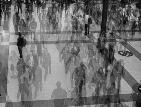 LONDON, UK - SEPTEMBER 28, 2015: Travellers at Liverpool Street Station multi exposure time lapse in black and whiteのeditorial素材