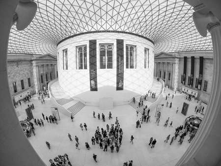 LONDON, UK - SEPTEMBER 28, 2015: Tourists in the Great Court at the British Museum designed by architect Lord Norman Foster opened in year 2000 seen with fisheye lens in black and whiteのeditorial素材