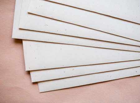 Letter envelopes for mail postage over orange paper backgroundの写真素材