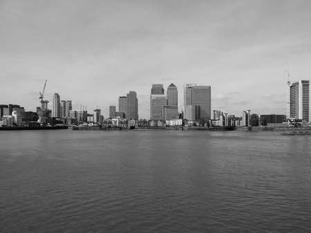 LONDON, UK - SEPTEMBER 29, 2015: The Canary Wharf business centre is the largest business district in the United Kingdom in black and whiteのeditorial素材