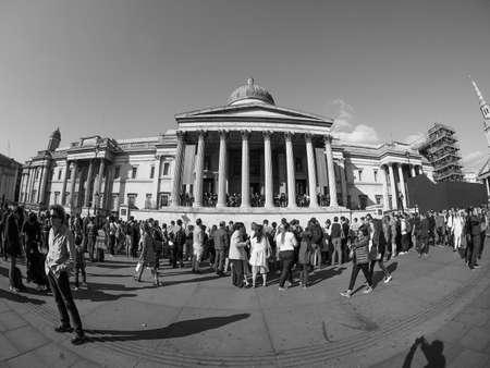 LONDON, UK - SEPTEMBER 27, 2015: Tourists in Trafalgar Square in front of the National Gallery in...
