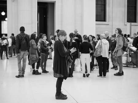 LONDON, UK - SEPTEMBER 28, 2015: Tourists in the Great Court at the British Museum designed by architect Lord Norman Foster opened in year 2000 in black and whiteのeditorial素材